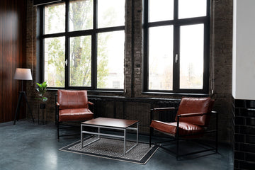 A room with modern industrial furniture.